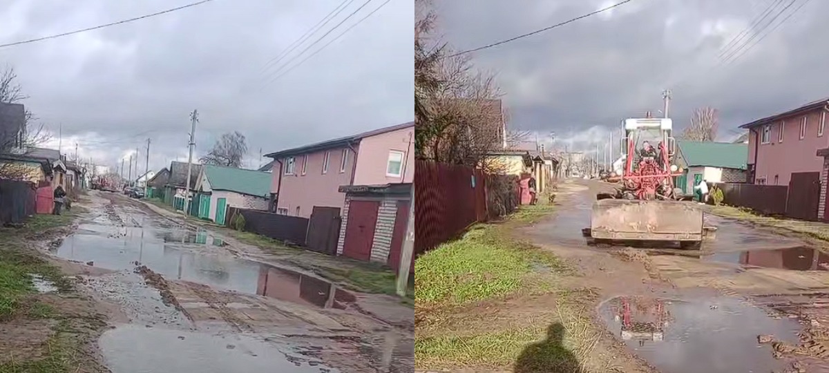 грейдер разносит грязь на улице с частным сектором